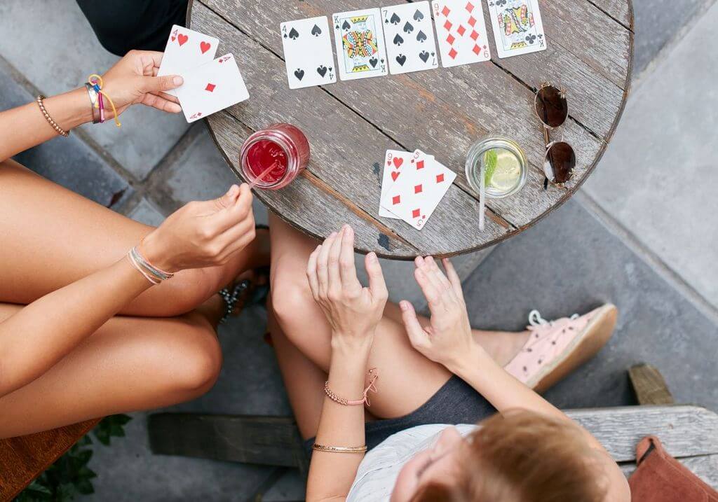 Playing American Card Game Uno, Holding Game Cards in Female Hand